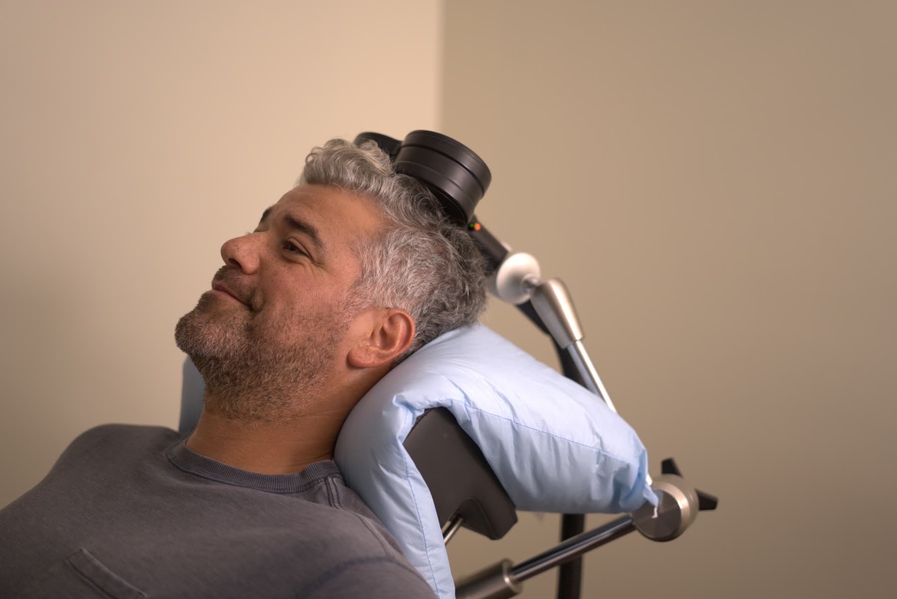 Patient receiving personalized TMS treatment